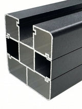 Close-up cross-section showing the hollow multi-channel profile of the black fence post
