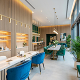Modern commercial interior with light oak acoustic slat wall panels and LED lighting
