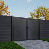 Dark gray wooden gate with matching fence in a garden setting