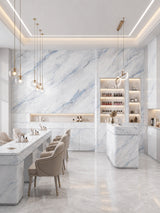 Bright commercial interior with 3D Bluewave PVC marble sheets covering walls, counters, and tables