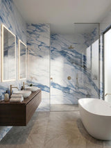 Calacatta Azur marble-look PVC wall panels surrounding a glass shower in a modern bathroom