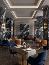 Doral Night black marble-look wall panels covering columns and accent walls in an elegant restaurant dining room