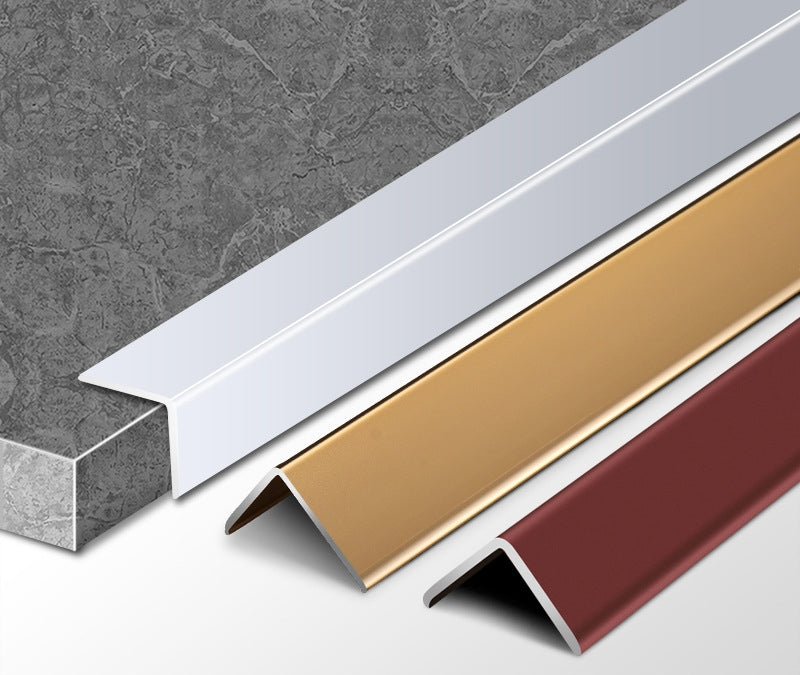 Silver aluminum L cap fitted to a gray stone-look panel beside gold and reddish-brown trim