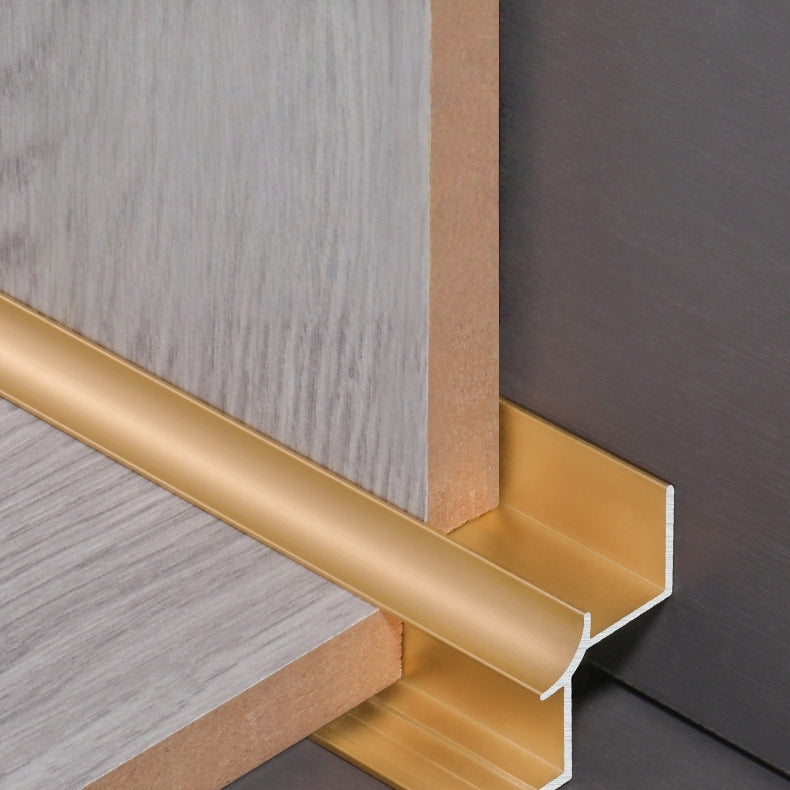 Gold aluminum inside corner trim cross-section showing how panel edges fit into the profile