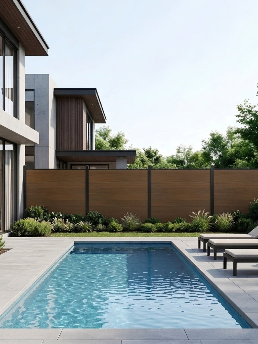 Walnut co-extrusion composite privacy fence installed beside a modern backyard swimming pool