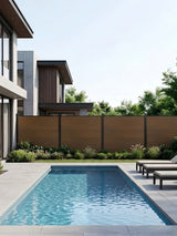 Walnut co-extrusion composite privacy fence installed beside a modern backyard swimming pool