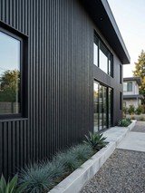 Durable black composite cladding boards for outdoor applications