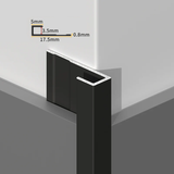 Black aluminum end cap trim fitted to a white PVC wall panel corner with profile dimensions