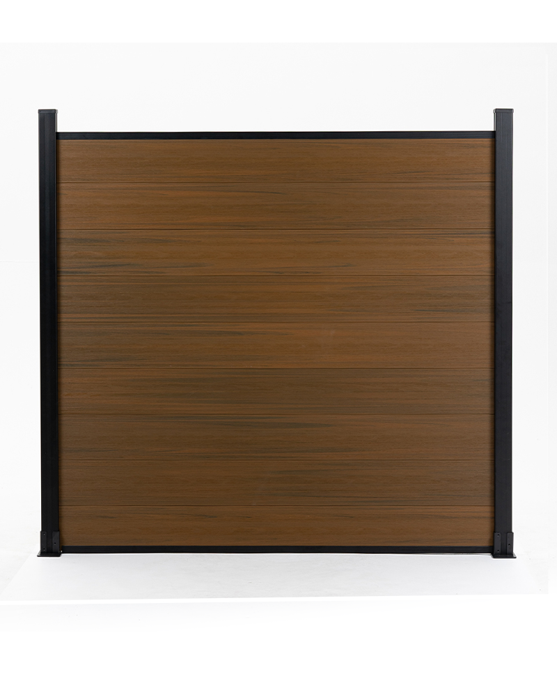 Brown composite fence with walnut wood grain pattern, supported by black metal posts, available at wholesale prices in New