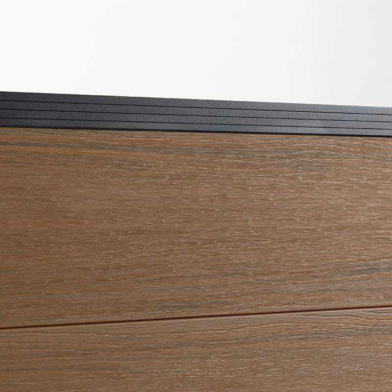 Brown composite fence with walnut finish, durable co-extrusion design, ideal for NJ decks with black metal railings.