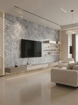 Gray rough-texture stone panels covering a modern living room TV wall