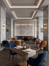 Gray rough-texture stone panels used on walls and columns in an elegant restaurant dining room