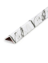 White marble-look corner trim with gray veining for acoustic and fluted wall panels