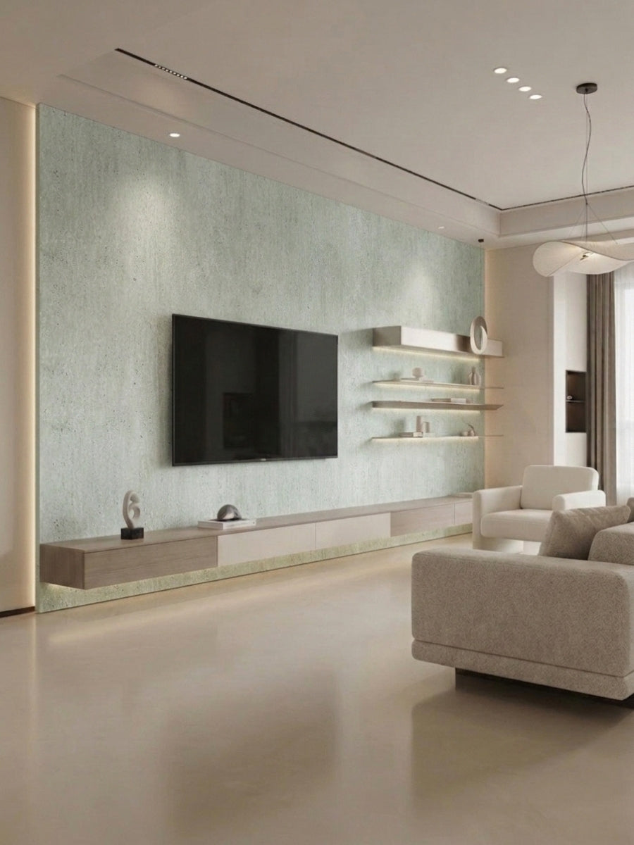 Travertine-look PVC sheets covering a pale green living room TV feature wall