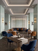Pale green rough-texture PVC sheets decorating restaurant walls and columns
