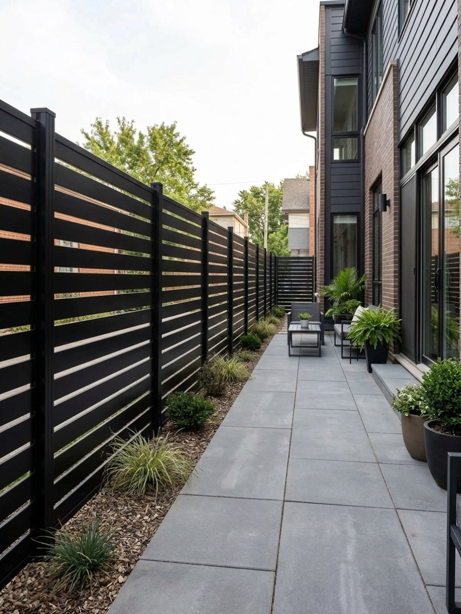 Black horizontal-slat aluminum semi privacy fence lining a paved side patio