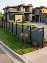 Long lattice-top composite fence bordering the lawn of a modern home
