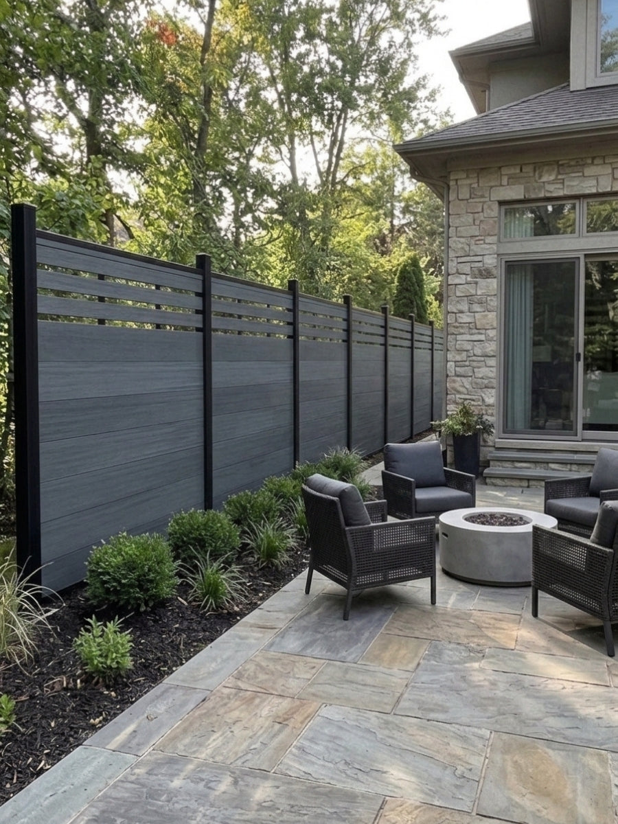 Composite lattice-top privacy fence installed along a stone house patio with fire pit seating