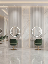 White brushed WPC fluted wall panels surrounding round illuminated mirrors in a modern salon