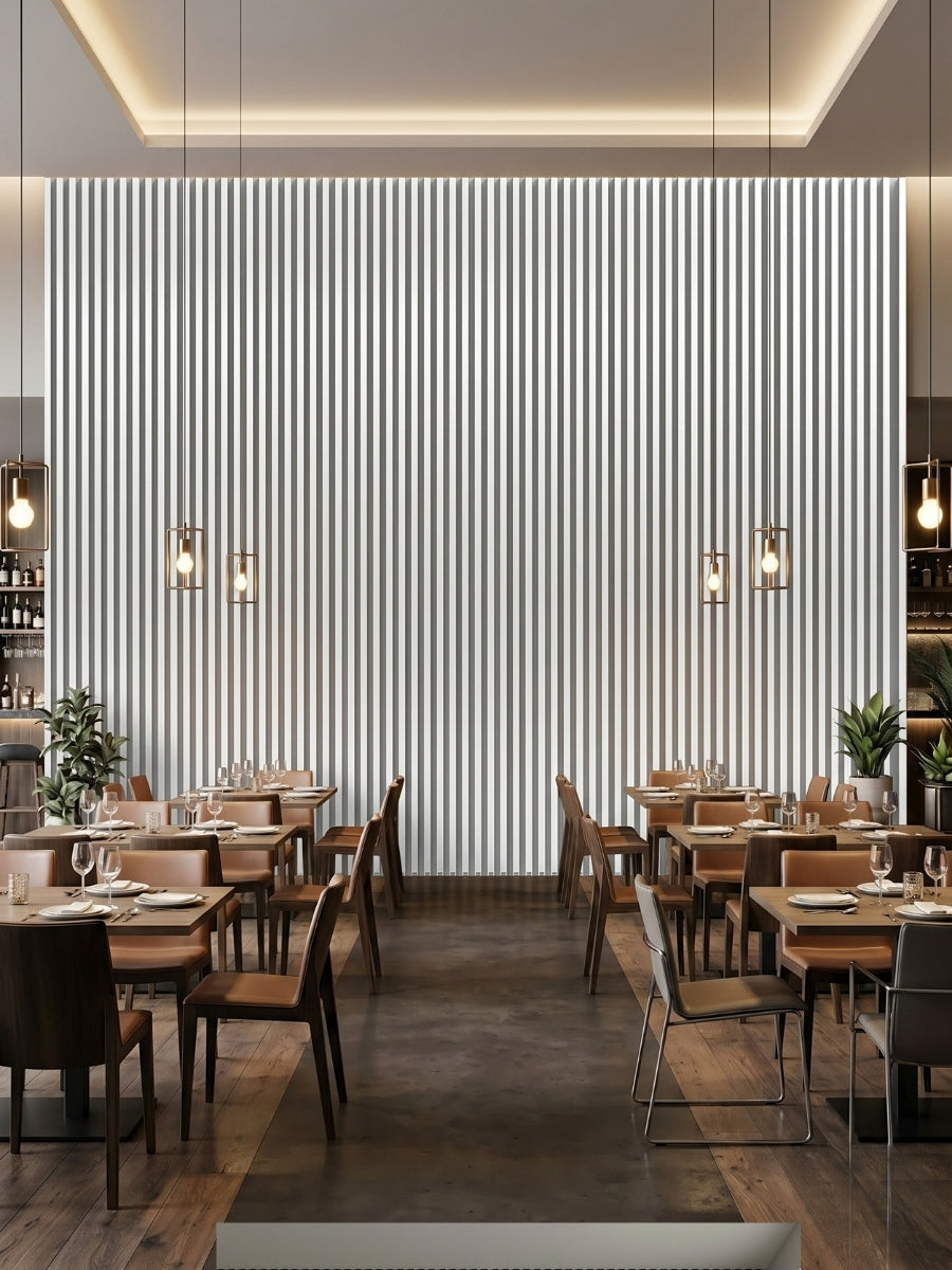 Floor-to-ceiling white brushed WPC fluted wall panels forming a feature wall in a restaurant dining area