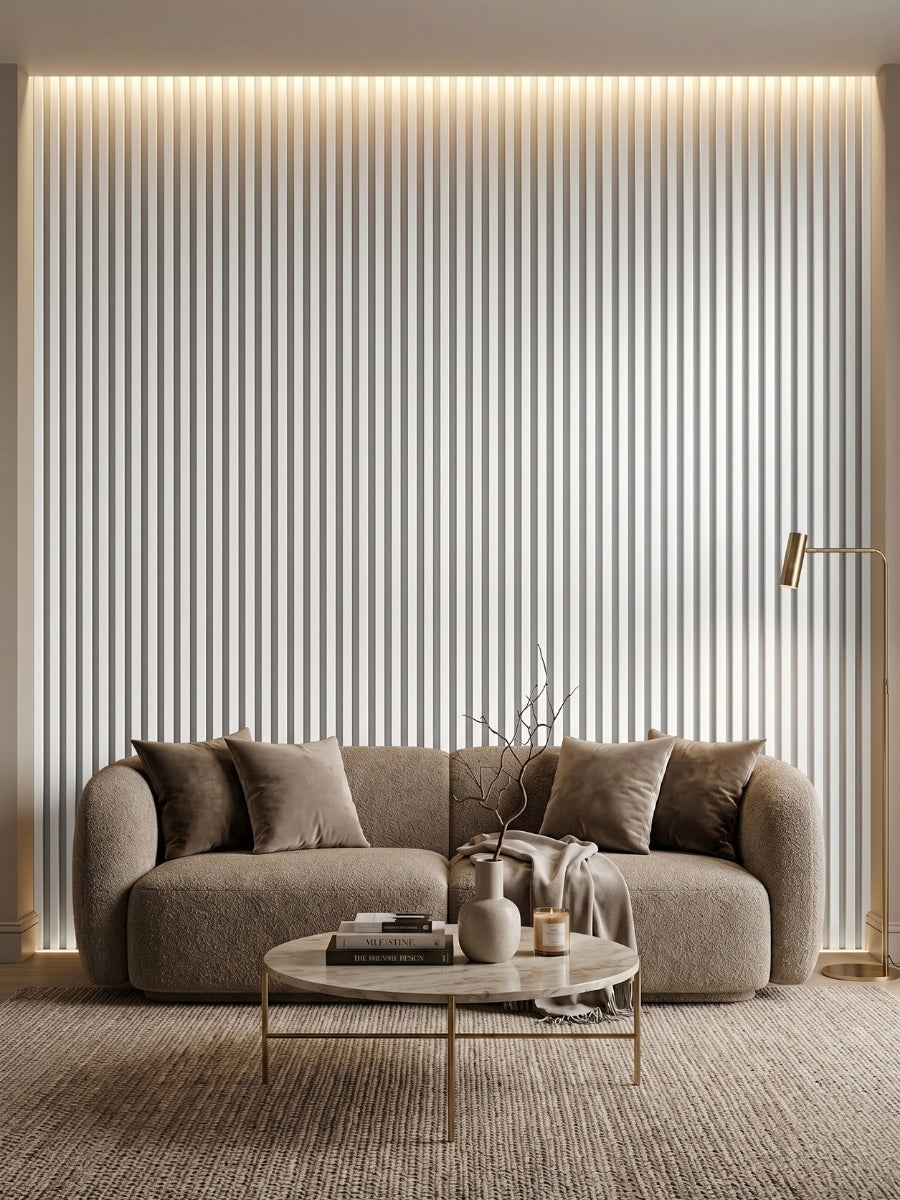 Floor-to-ceiling white brushed WPC fluted wall panels framing a curved sofa in a neutral living room