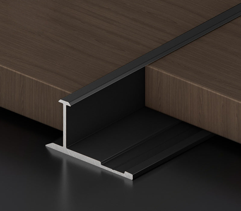 Black 3mm aluminum H-joint connection trim fitted between dark wood-look wall panels