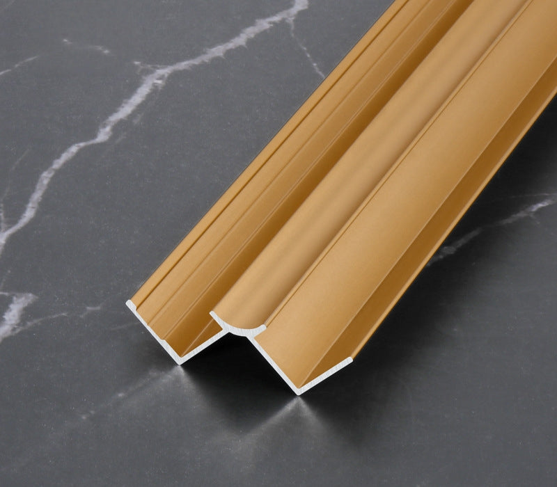 Gold 3mm aluminum inside corner trim with rounded center channel and side flanges