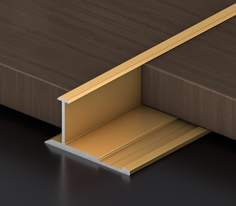 Gold 3mm aluminum H-joint connection trim fitted between dark wood-look wall panels