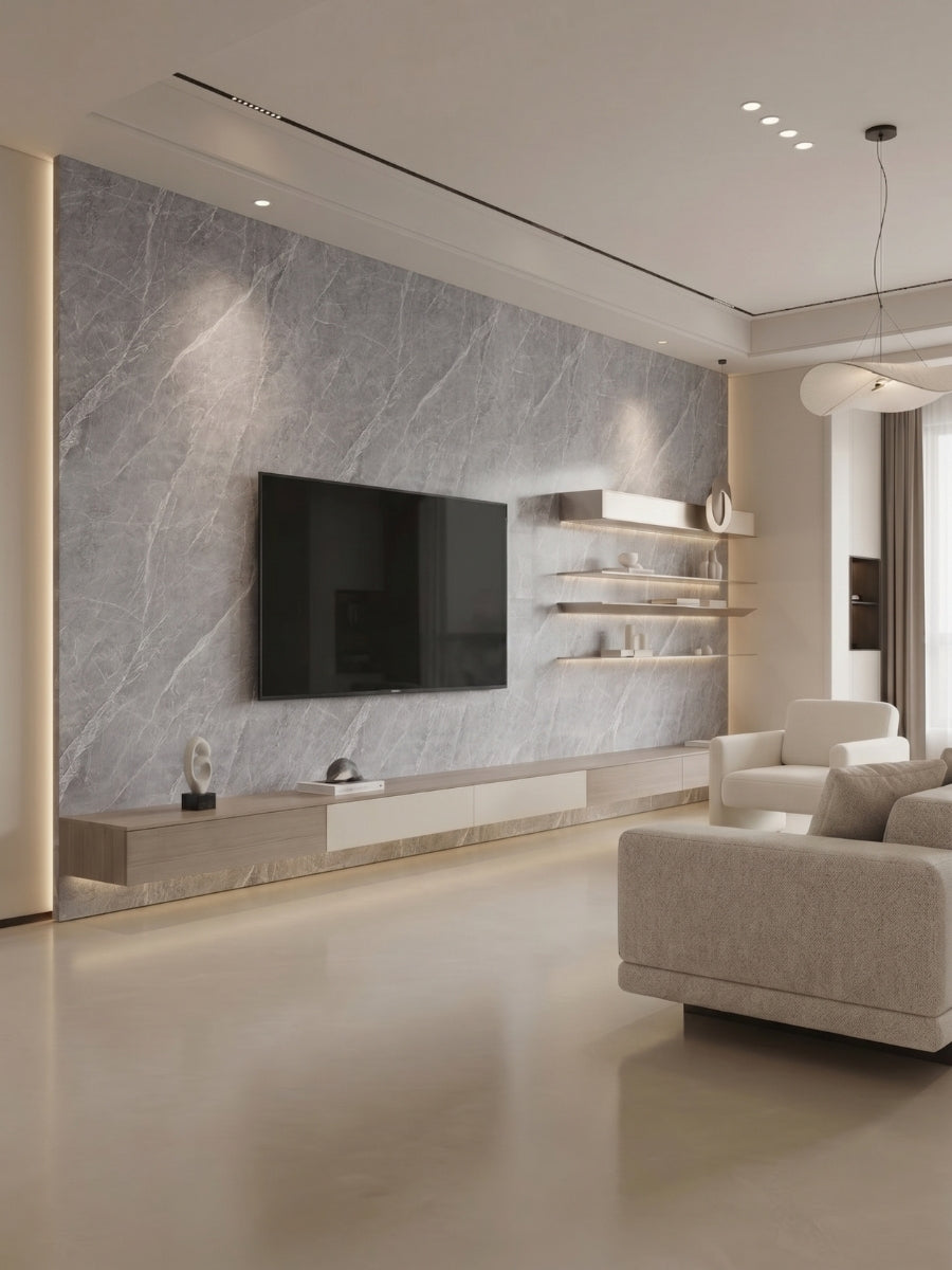 Modern living room with an ash gray marble PVC feature wall, mounted TV, and floating shelves