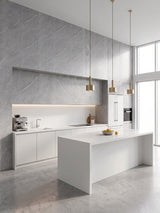 Ash gray marble PVC wall panels installed as a feature wall in a modern white kitchen