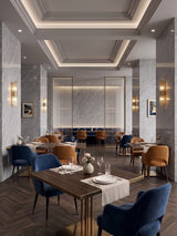 Restaurant interior with ash gray marble PVC wall panels, set tables, and blue and tan chairs
