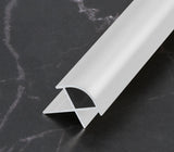 Silver 3mm aluminum outside corner trim with rounded face on a dark marble surface
