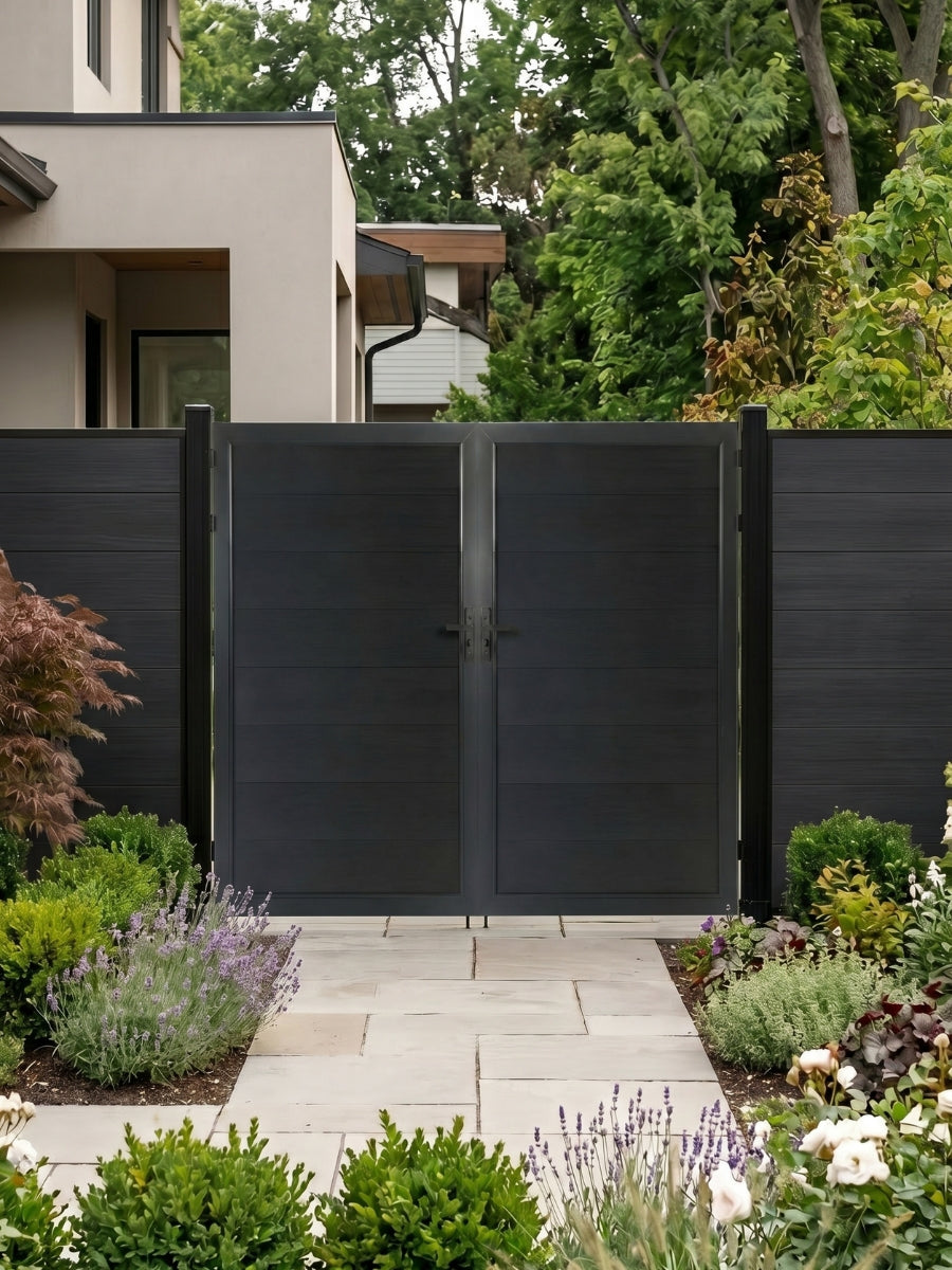 8ft x 6ft black WPC double fence gate with horizontal panels installed along a landscaped garden walkway