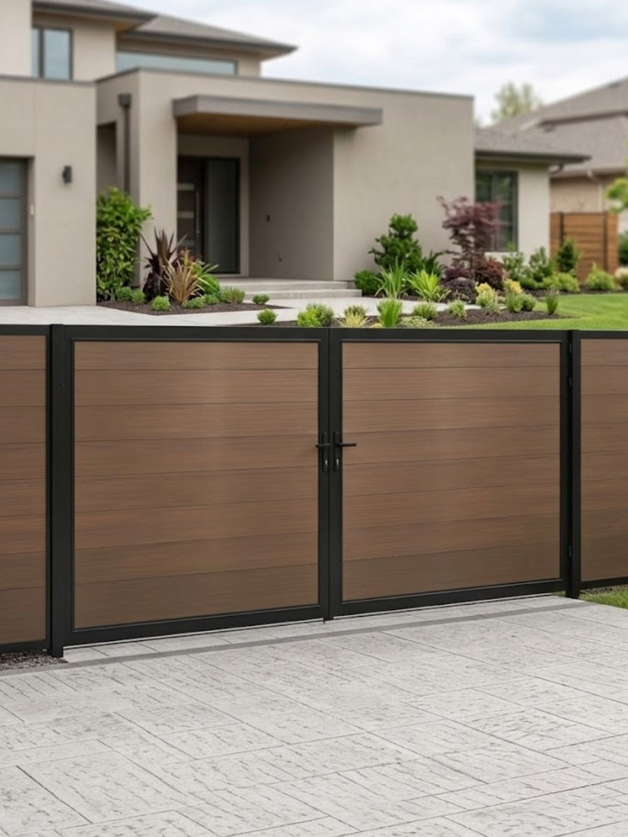 12ft x 6ft brown wood-grain WPC double fence gate with black metal frame installed across a modern residential driveway.