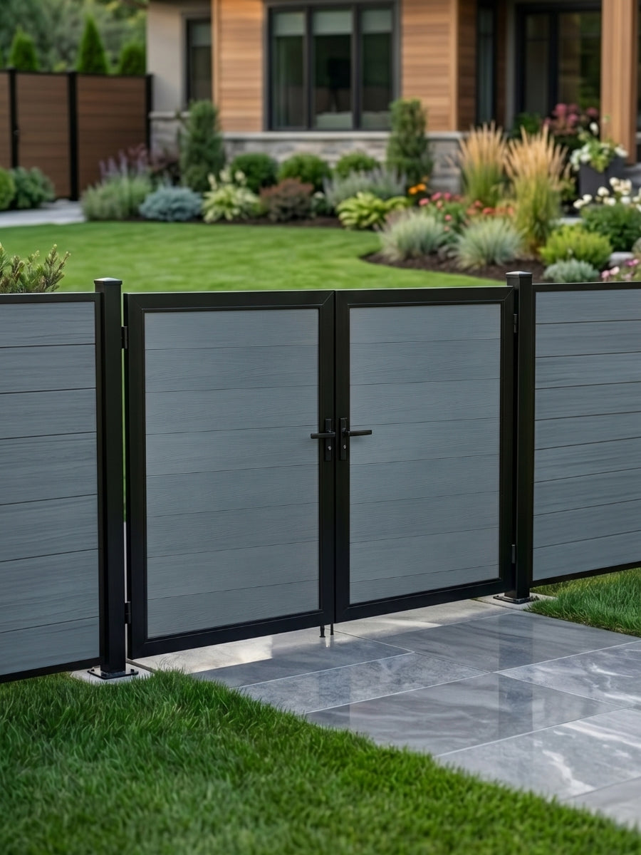 8ft x 6ft gray WPC double fence gate with black frame and horizontal panels installed along a landscaped backyard