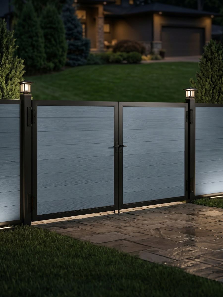 12ft x 6ft gray WPC double fence gate with black metal frame and illuminated post lights at a modern residential entrance.