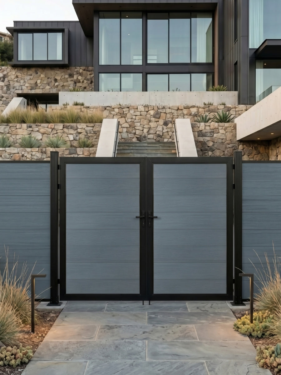 8ft x 6ft gray WPC double fence gate with black frame installed at the entrance of a modern stone-accented home