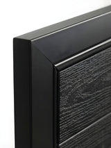 Black WPC composite fence gate installed in backyard privacy fence